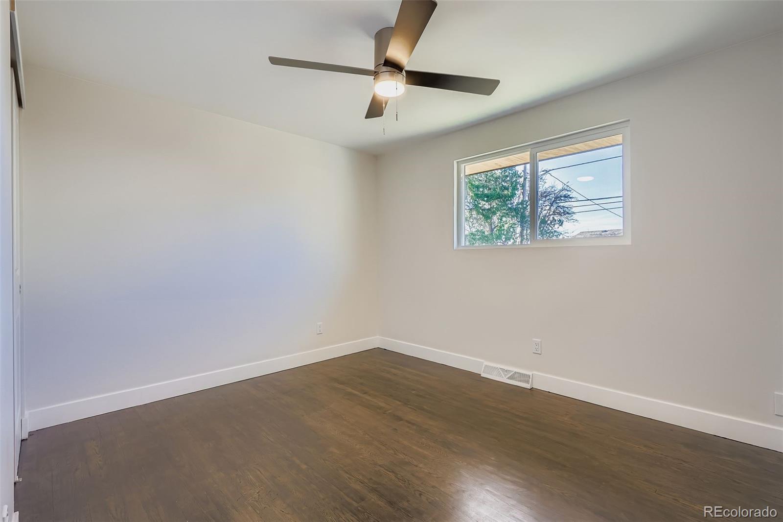 8771 Rutgers Street Westminster, CO 80031 - Photo 10 of 25 a view of room with hardwood floor and ceiling fan
