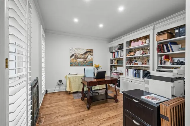 a spacious bathroom with a granite countertop sink a mirror and a shower