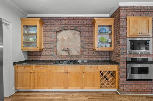 a en suite bathroom with double vanity a sink and a mirror