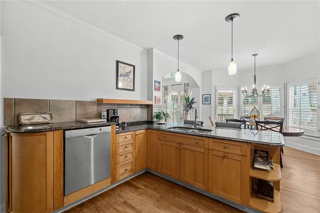 a bathroom with a sink a toilet a mirror a bathtub and shower