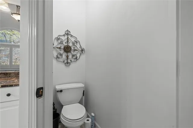 a room with stainless steel appliances kitchen island granite countertop a refrigerator dining table chairs stove and kitchen view