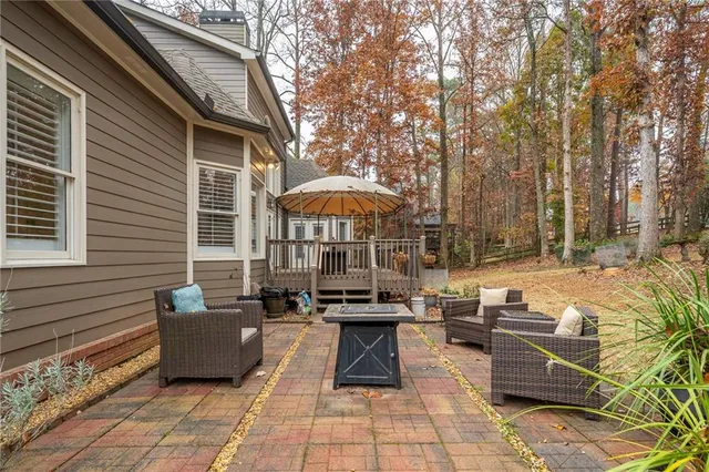 a view of a hallway with wooden floor and stairs