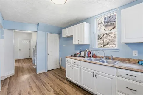 a kitchen with a sink and cabinets