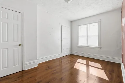 a view of empty room with windows