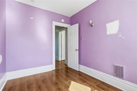 a view of a livingroom with wooden floor