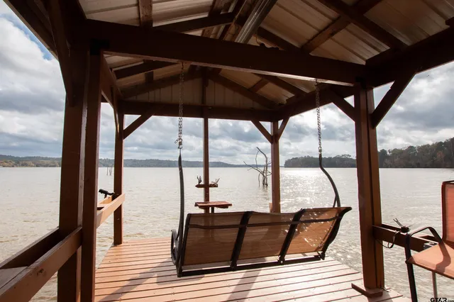 a view of balcony with wooden floor