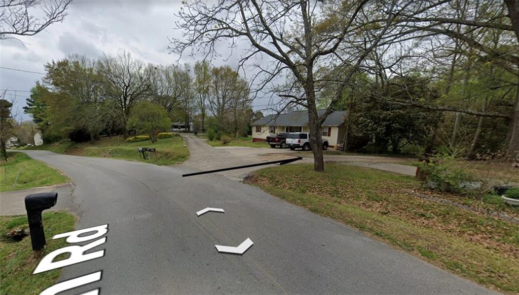 0 Osborne Road Flowery Branch, GA 30542 - Photo 3 of 19 a view of a street with a yard