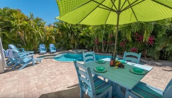 a view of yard with patio and table