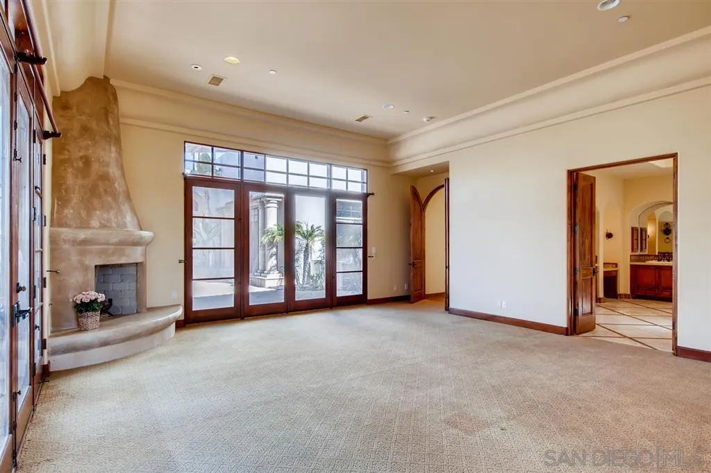 14160 Bryce Point Poway, CA 92064 - Photo 11 of 25 a view of an empty room with a fireplace and a window