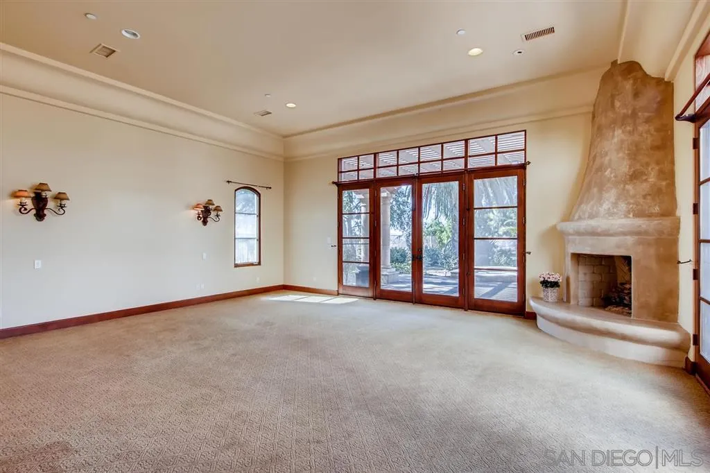 14160 Bryce Point Poway, CA 92064 - Photo 12 of 25 a view of an empty room with a fireplace and a window