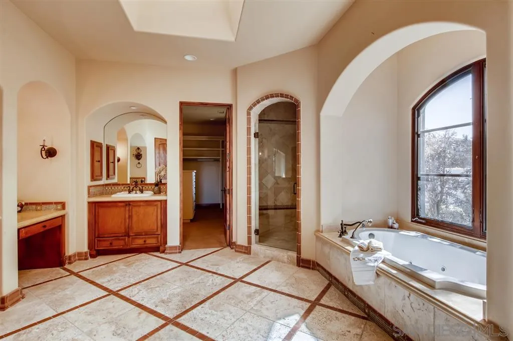 14160 Bryce Point Poway, CA 92064 - Photo 14 of 25 a spacious bathroom with a glass door shower and sink