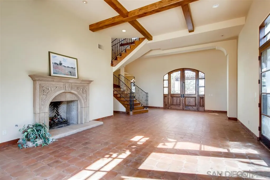 14160 Bryce Point Poway, CA 92064 - Photo 4 of 25 a view of a livingroom with furniture a fireplace and windows