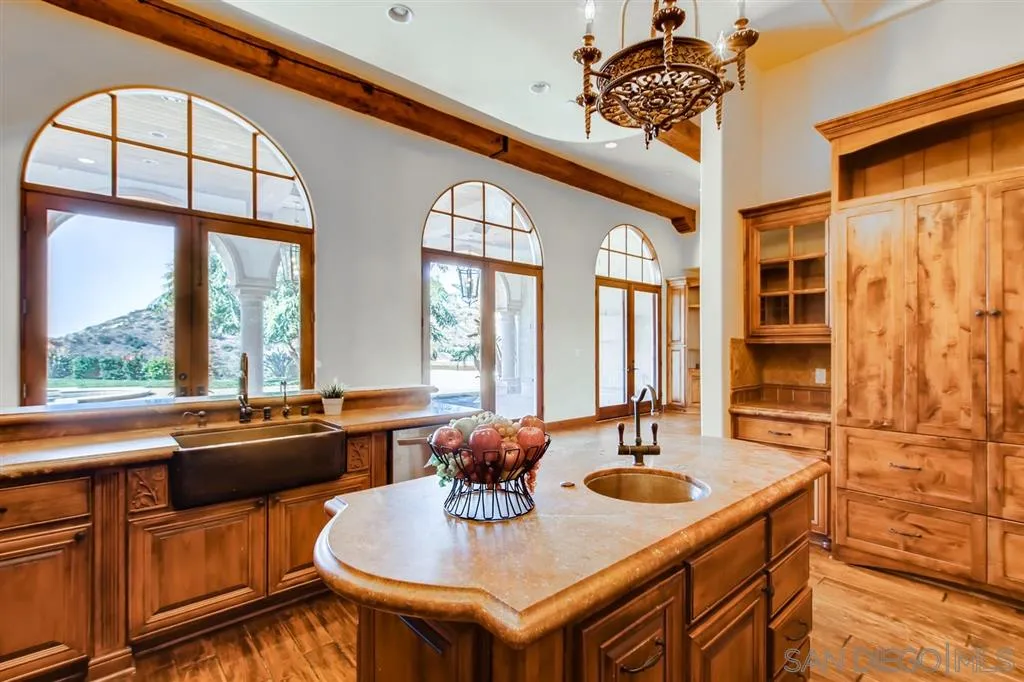 14160 Bryce Point Poway, CA 92064 - Photo 9 of 25 a kitchen with a table chairs and window
