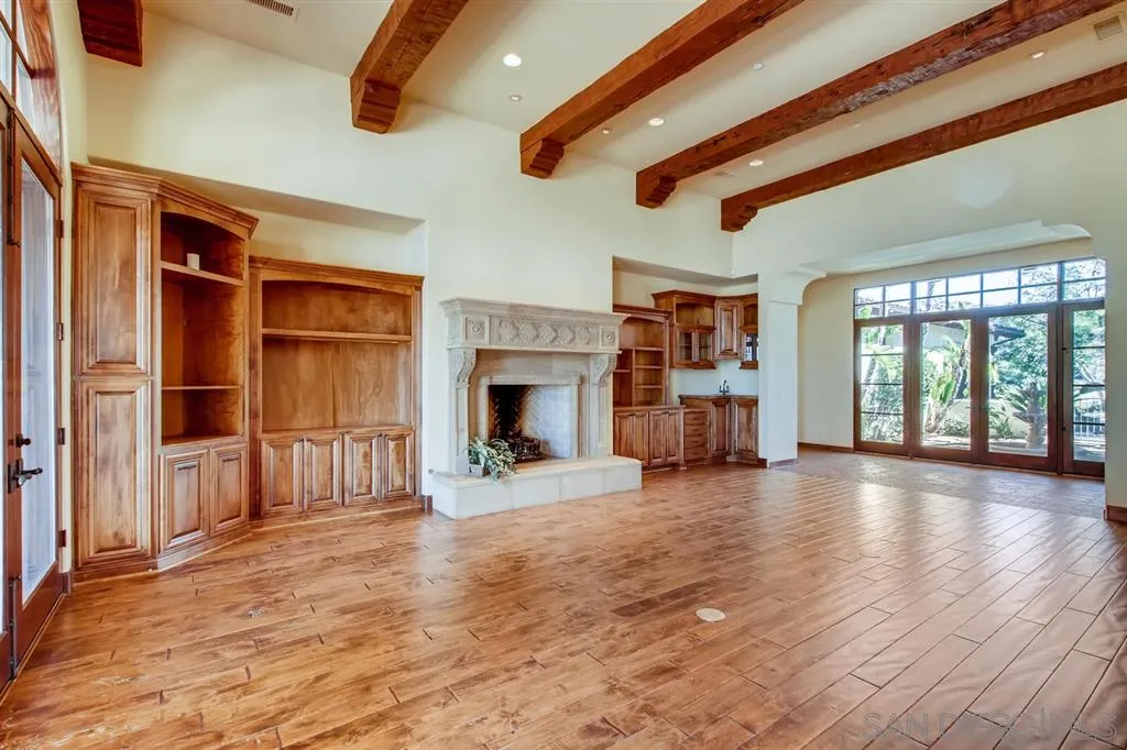 14160 Bryce Point Poway, CA 92064 - Photo 10 of 25 a view of a hall with wooden floor and a fireplace