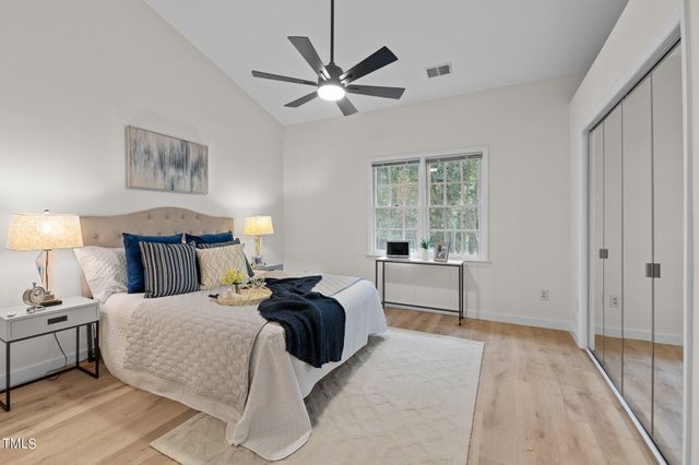 a bed room with a bed and a window