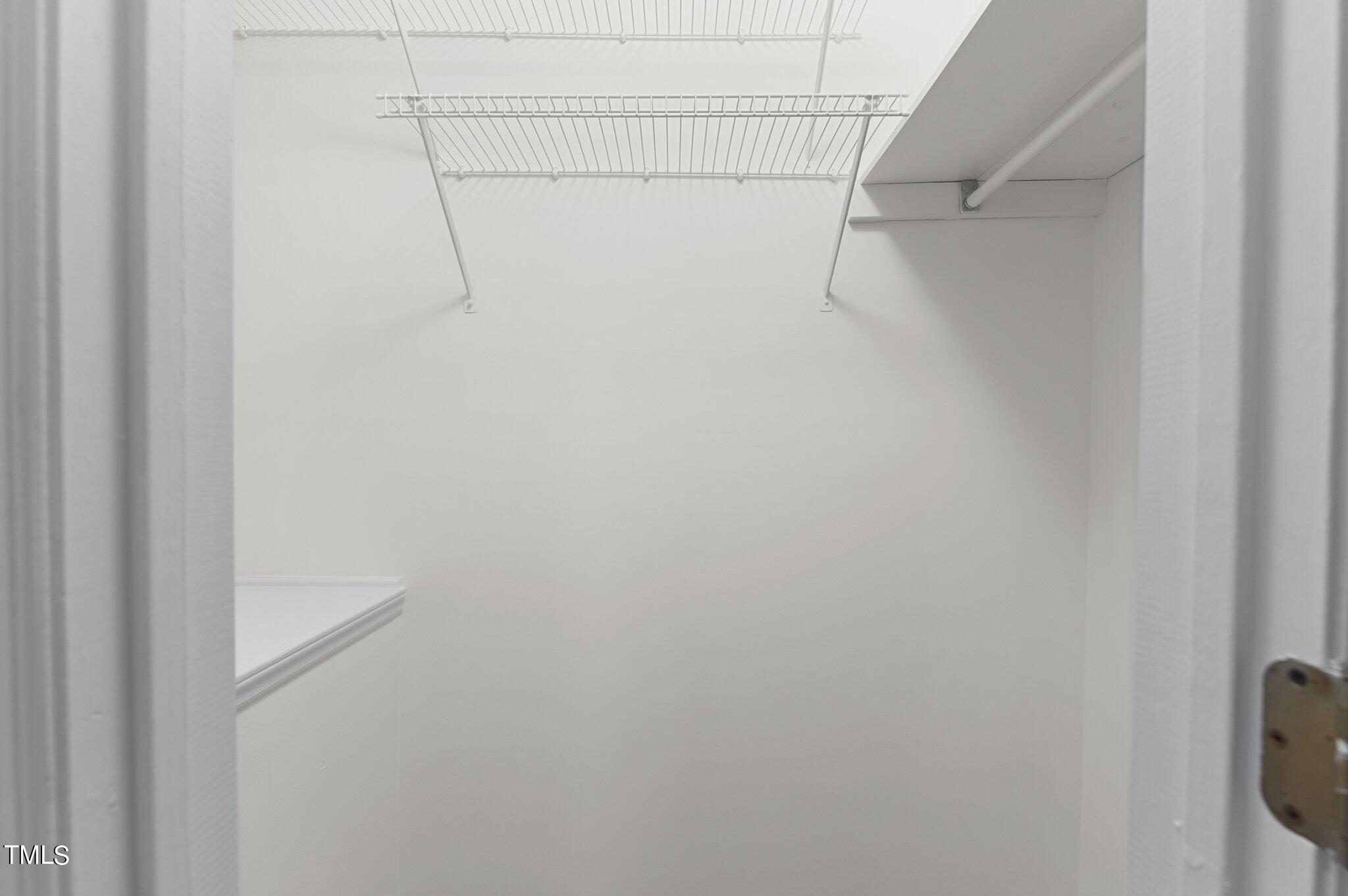 1440 Barton Pl Drive Raleigh, NC 27608 - Photo 26 of 57 a view of a room with racks on the wall