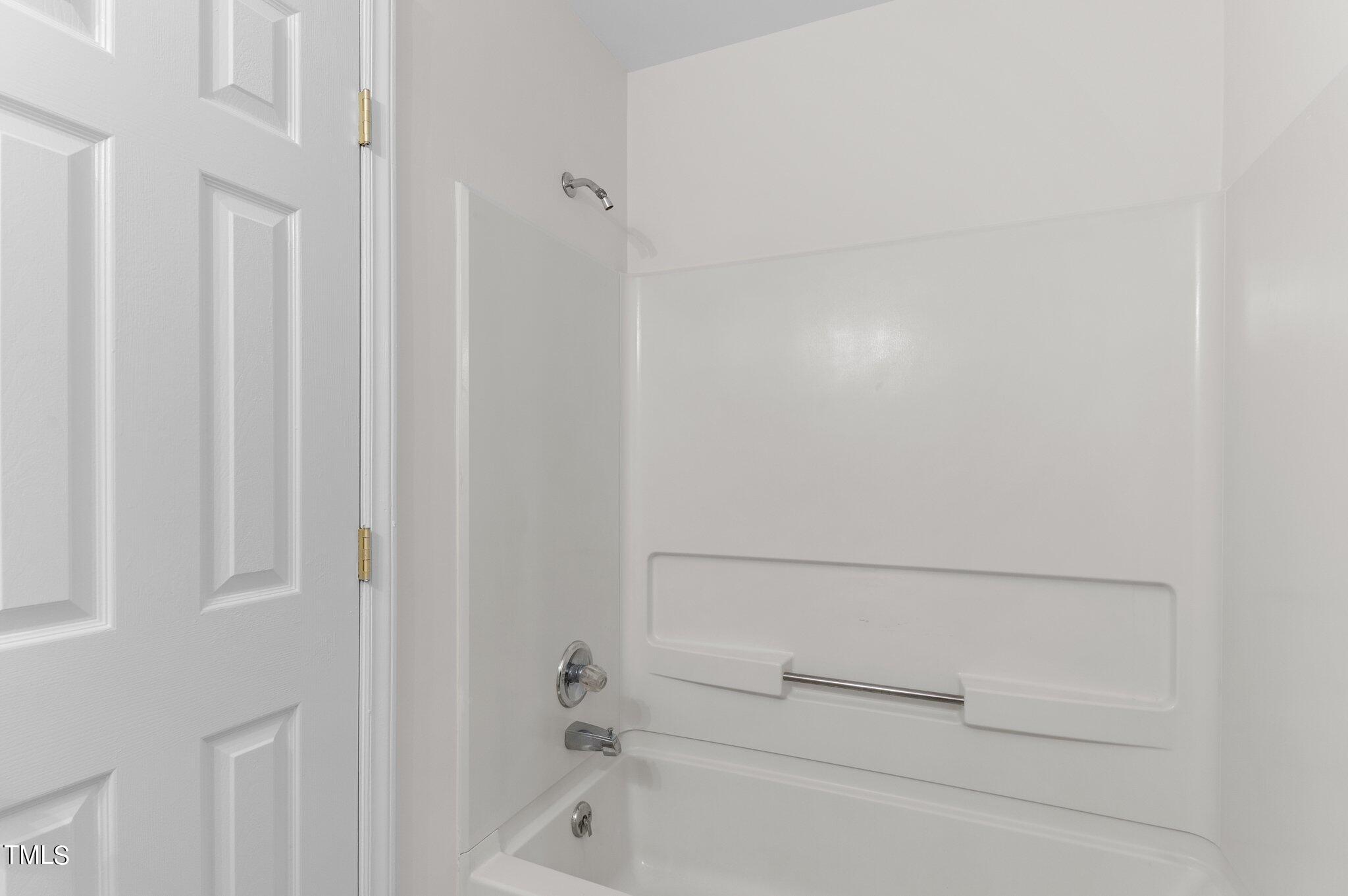 1440 Barton Pl Drive Raleigh, NC 27608 - Photo 30 of 57 a bathroom with a bathtub