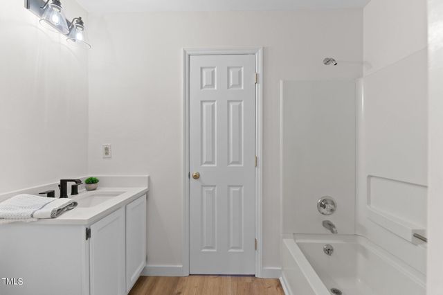 a bathroom with a sink and vanity