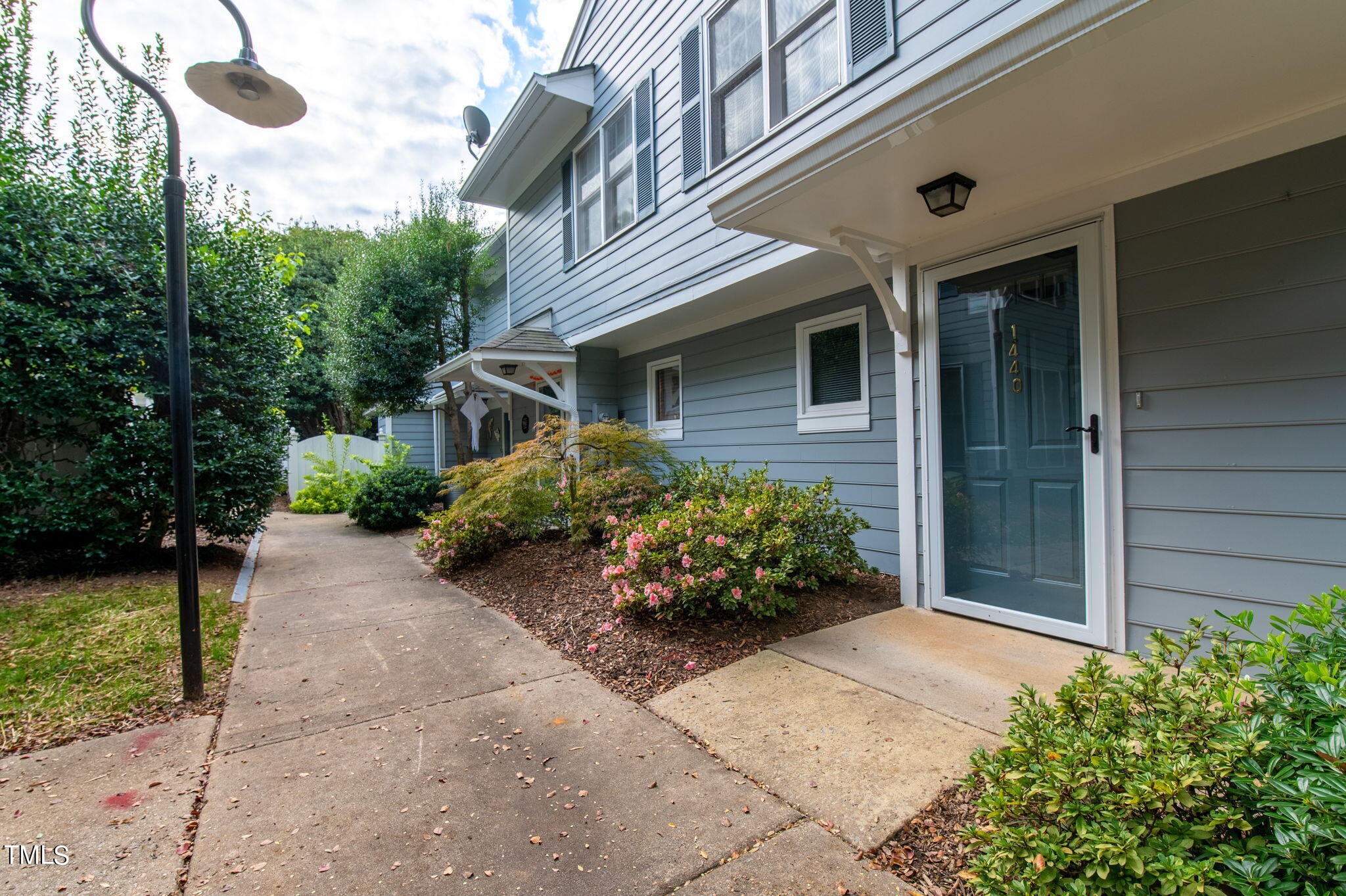 1440 Barton Pl Drive Raleigh, NC 27608 - Photo 56 of 57 a front view of a house with garden