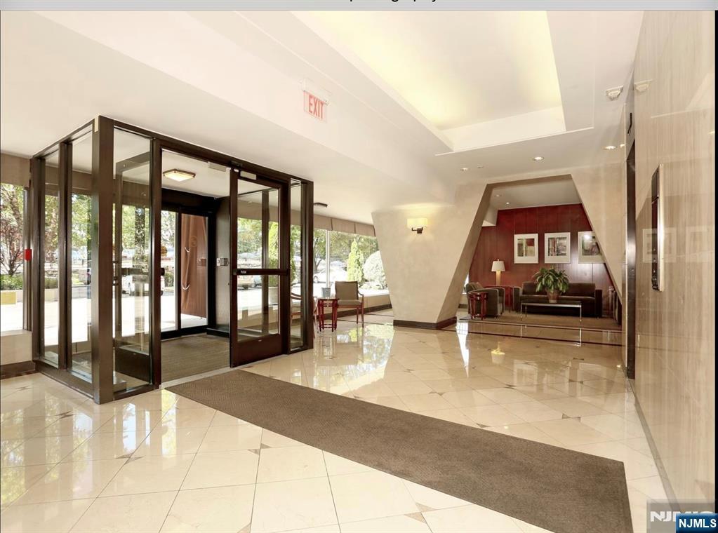 2 Horizon Road, Unit G2 Fort Lee, NJ 07024 - Photo 2 of 18 a lobby with furniture and floor to ceiling window