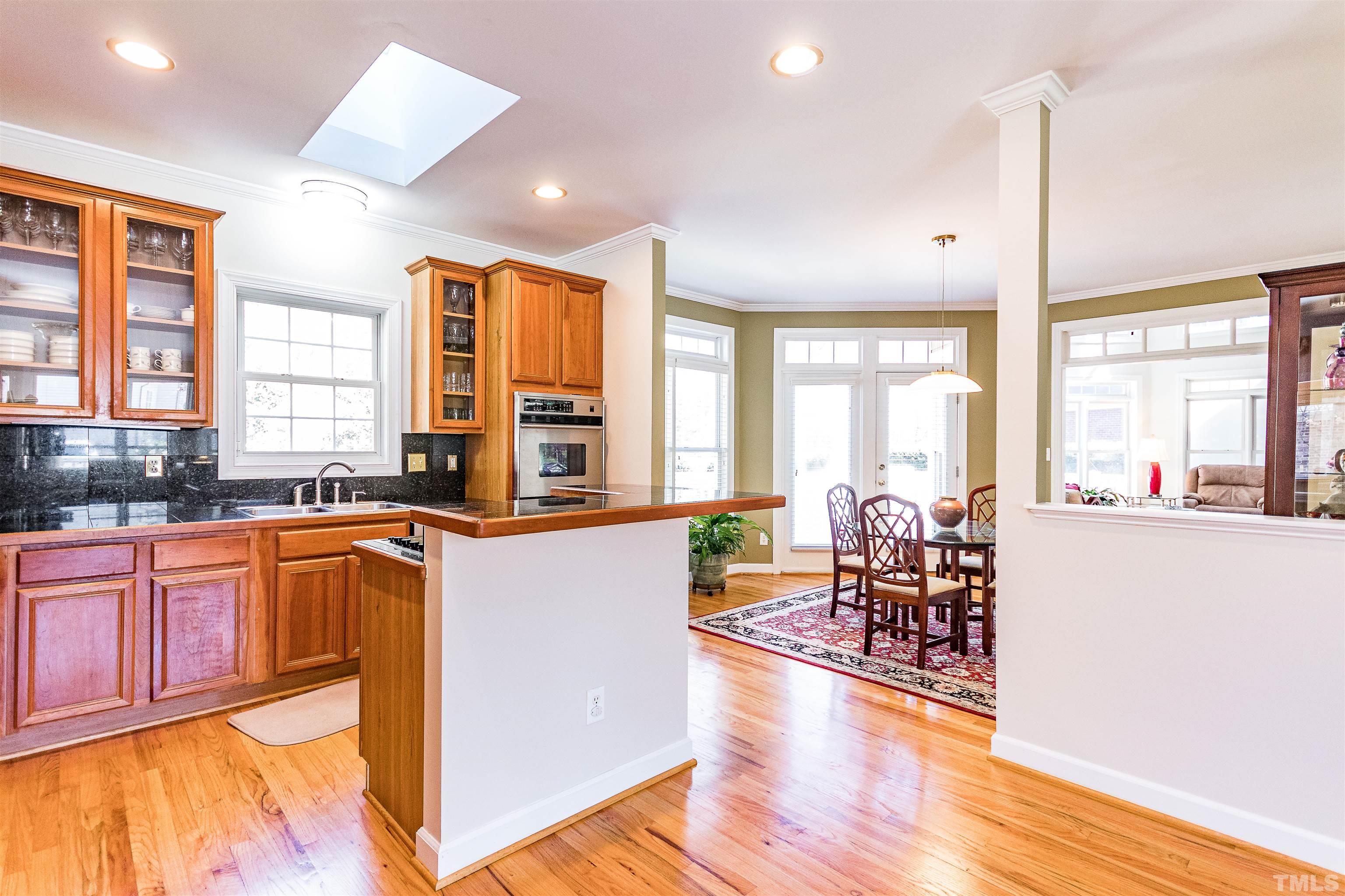 3324 Edgemont Drive Raleigh, NC 27612 - Photo 13 of 29 a large kitchen with lots of counter top space and stainless steel appliances