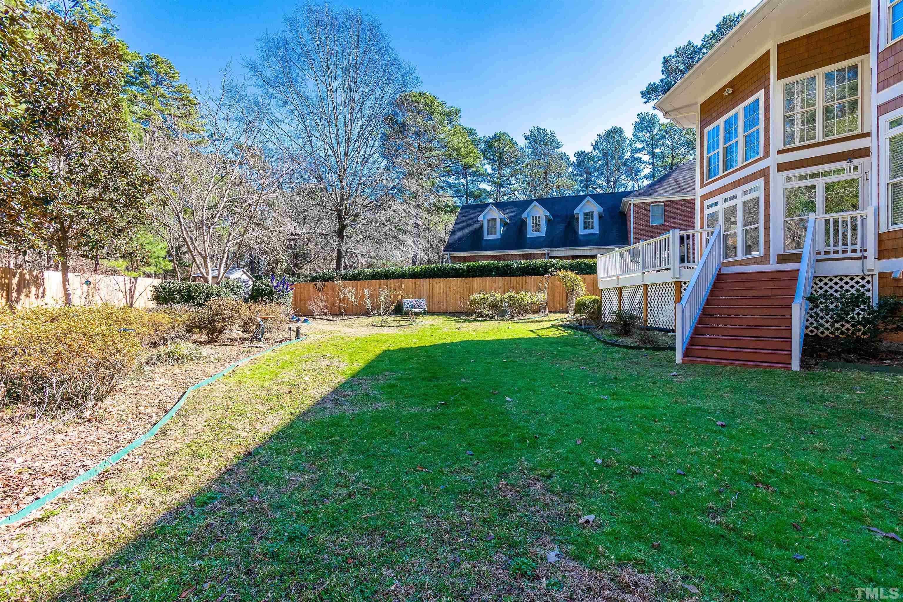 3324 Edgemont Drive Raleigh, NC 27612 - Photo 28 of 29 a view of a house with a yard patio and a yard