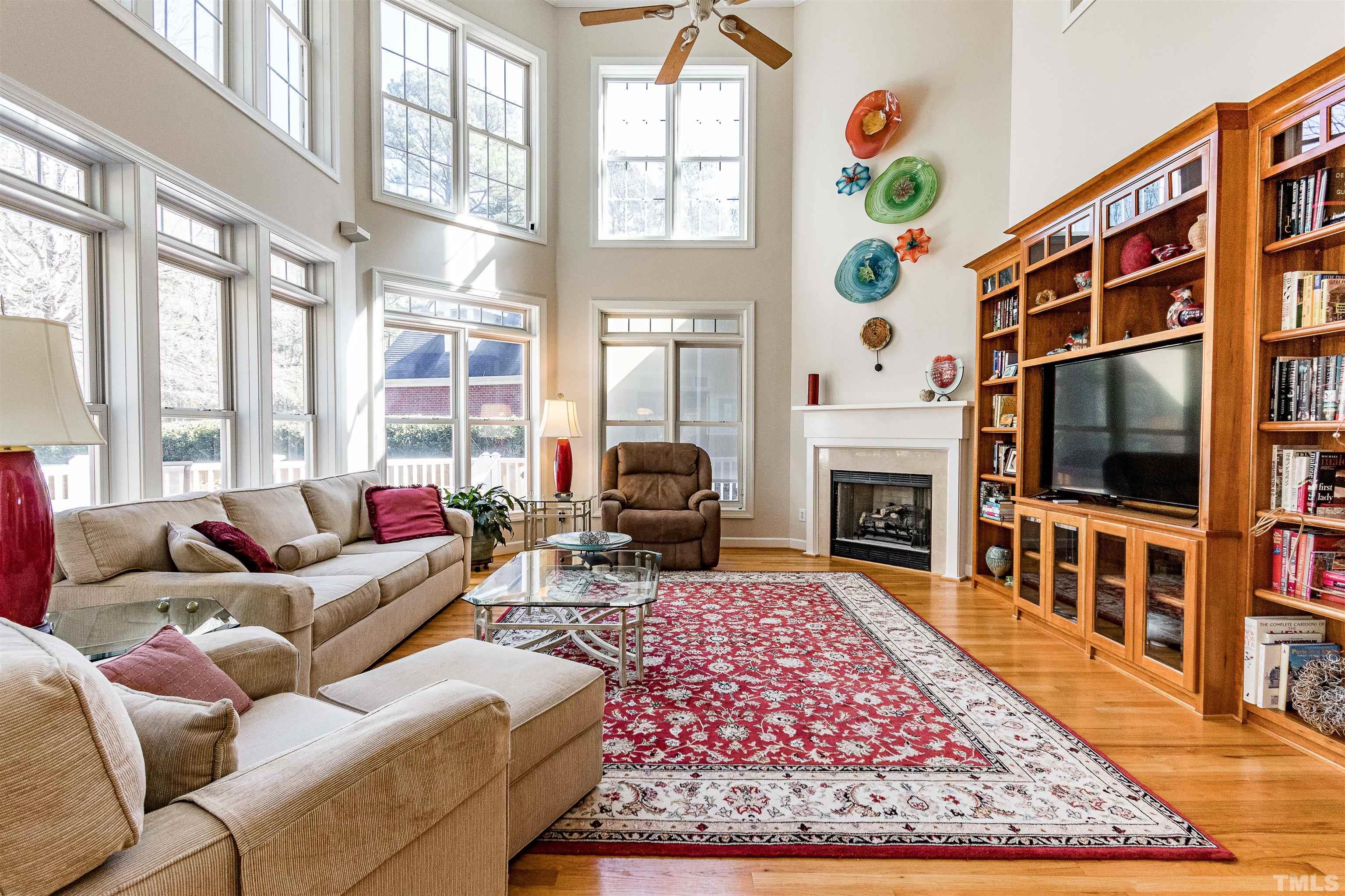 3324 Edgemont Drive Raleigh, NC 27612 - Photo 8 of 29 a living room with fireplace furniture and a flat screen tv