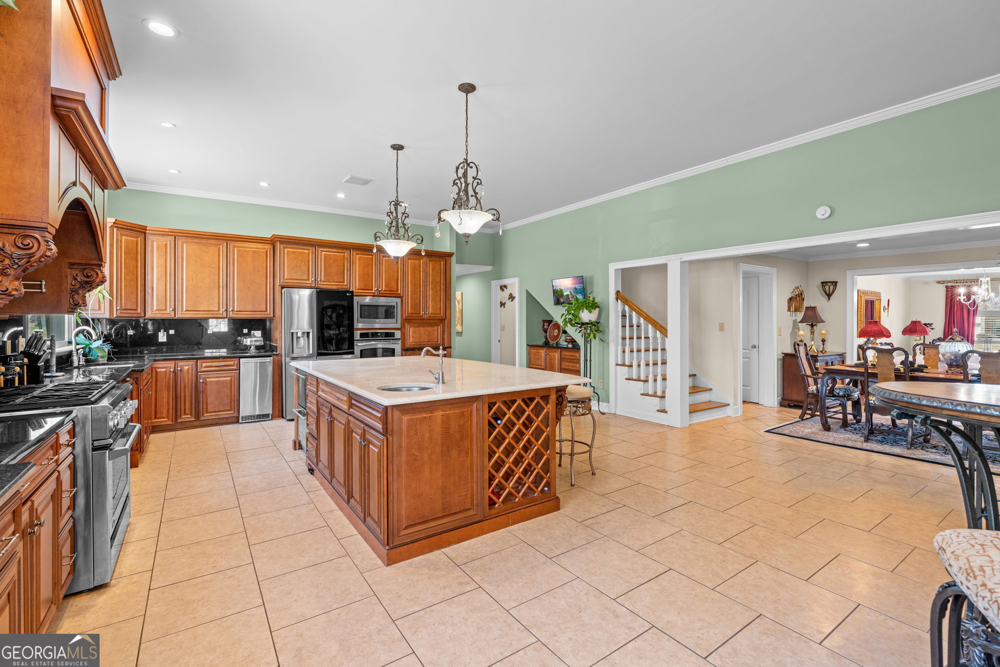 109 Crest Pointe Warner Robins, GA 31088 - Photo 19 of 86 a kitchen with stainless steel appliances granite countertop a sink and cabinets