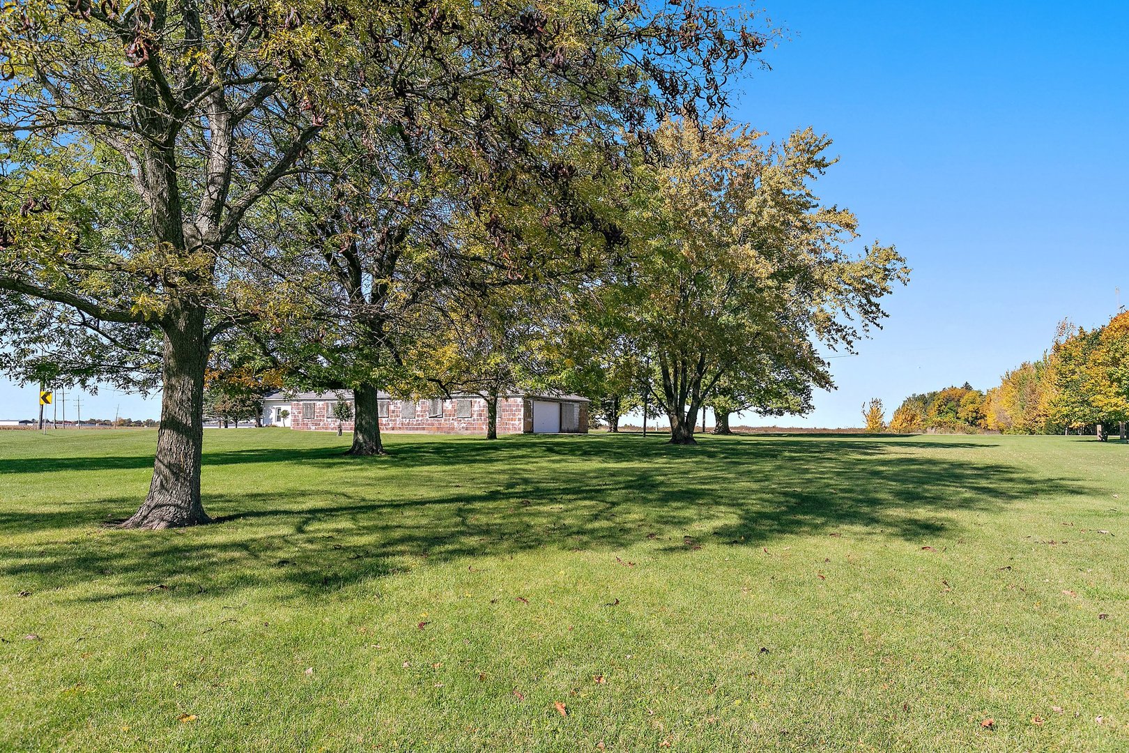 10178 Preserve Road Waterman, IL 60556 - Photo 17 of 18 a big yard with lots of trees and plants