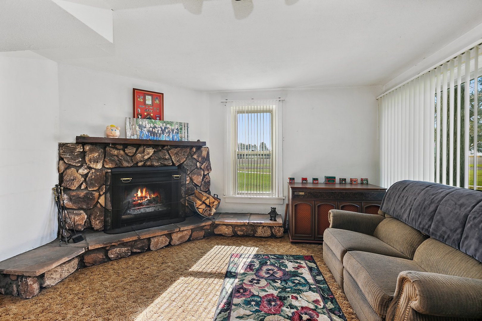 10178 Preserve Road Waterman, IL 60556 - Photo 7 of 18 a living room with furniture a window and a fireplace