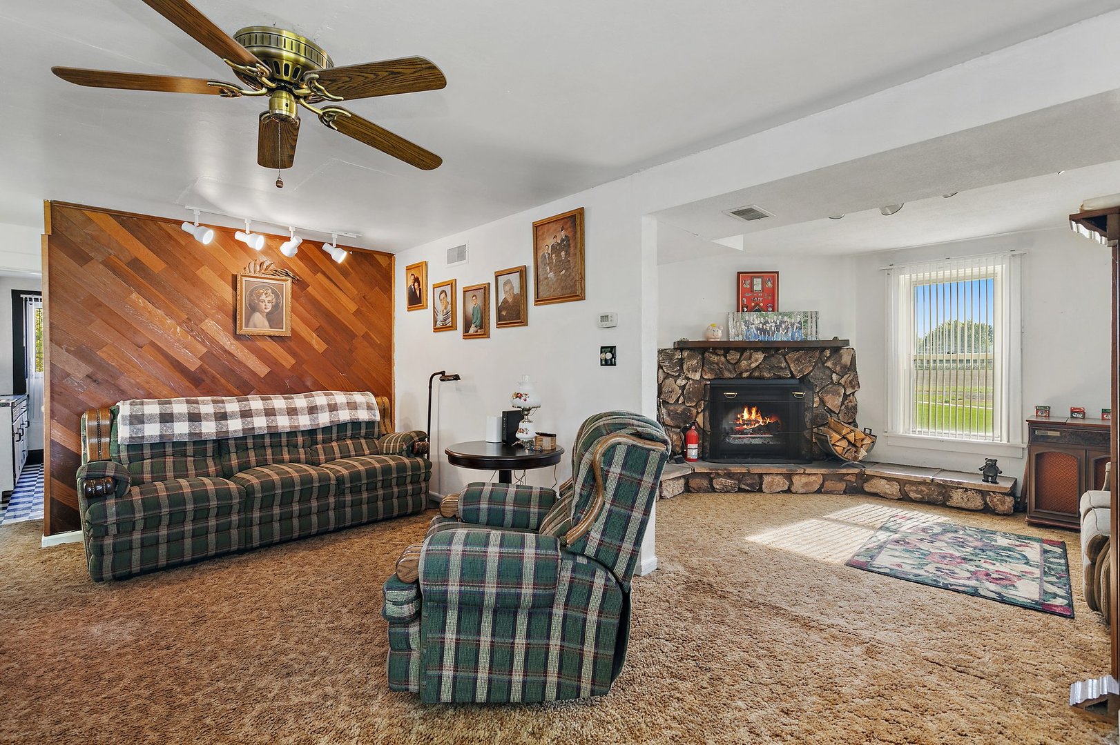 10178 Preserve Road Waterman, IL 60556 - Photo 8 of 18 a living room with furniture a couch and a flat screen tv