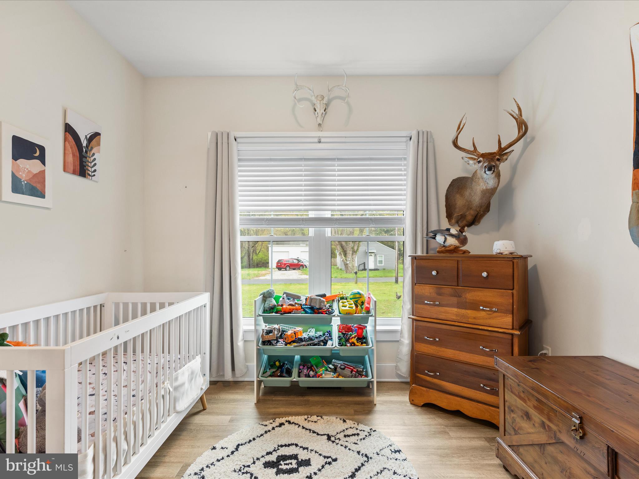 9741 Mason Road Berlin, MD 21811 - Photo 14 of 71 a bedroom with furniture and a baby crib