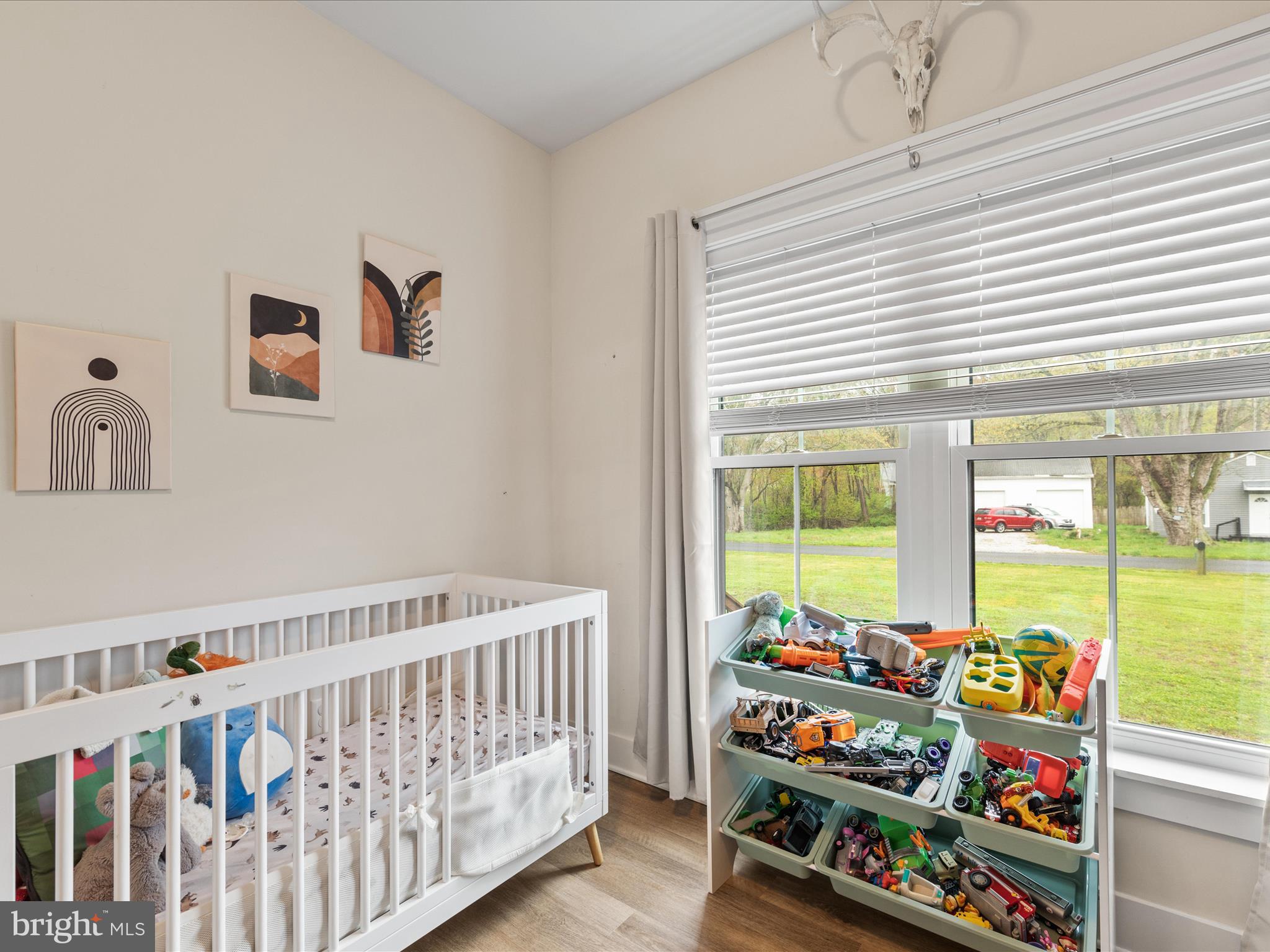 9741 Mason Road Berlin, MD 21811 - Photo 16 of 71 a bedroom with furniture a baby crib and a window
