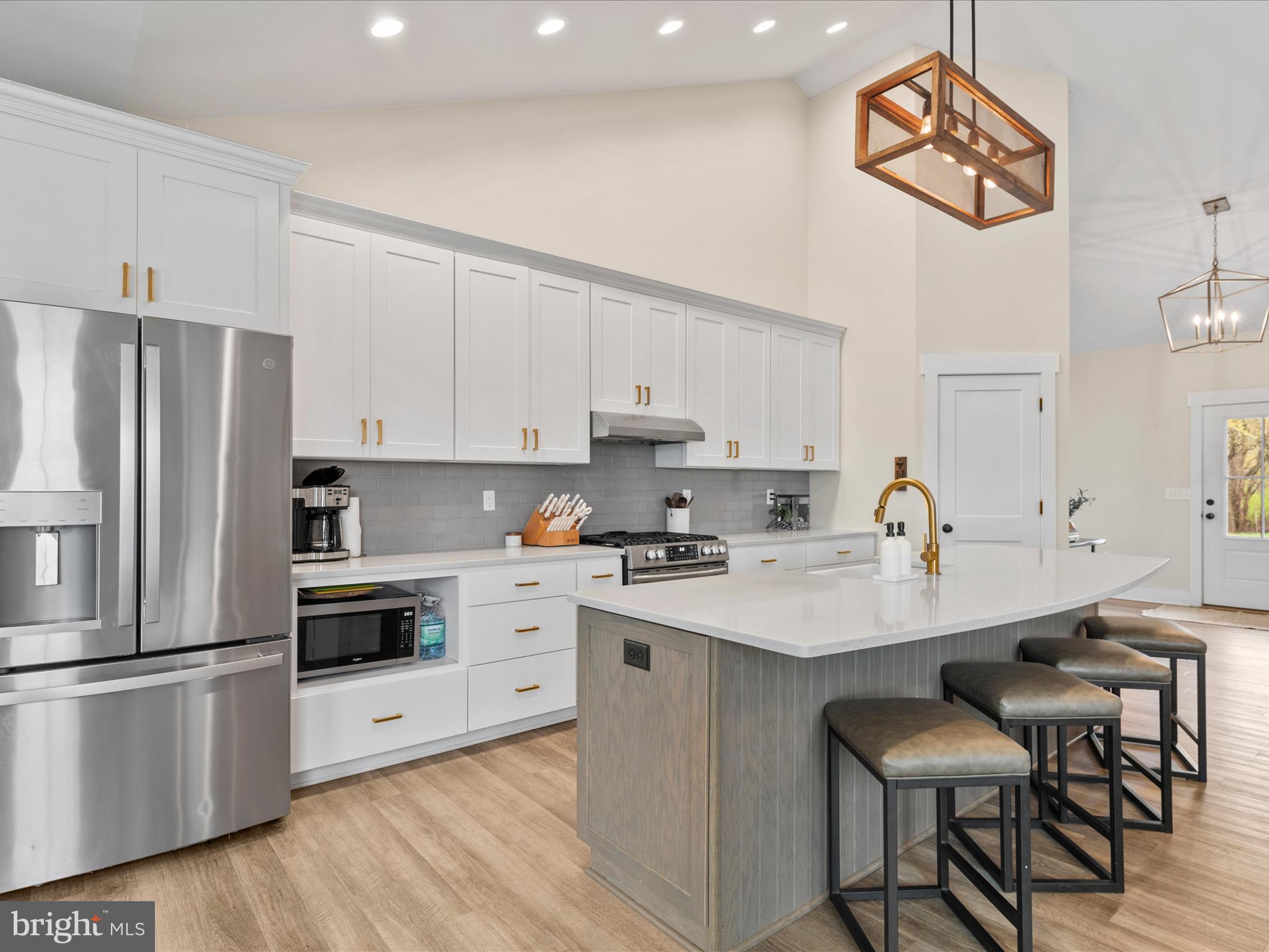 9741 Mason Road Berlin, MD 21811 - Photo 18 of 71 a kitchen with stainless steel appliances a stove a sink and a refrigerator