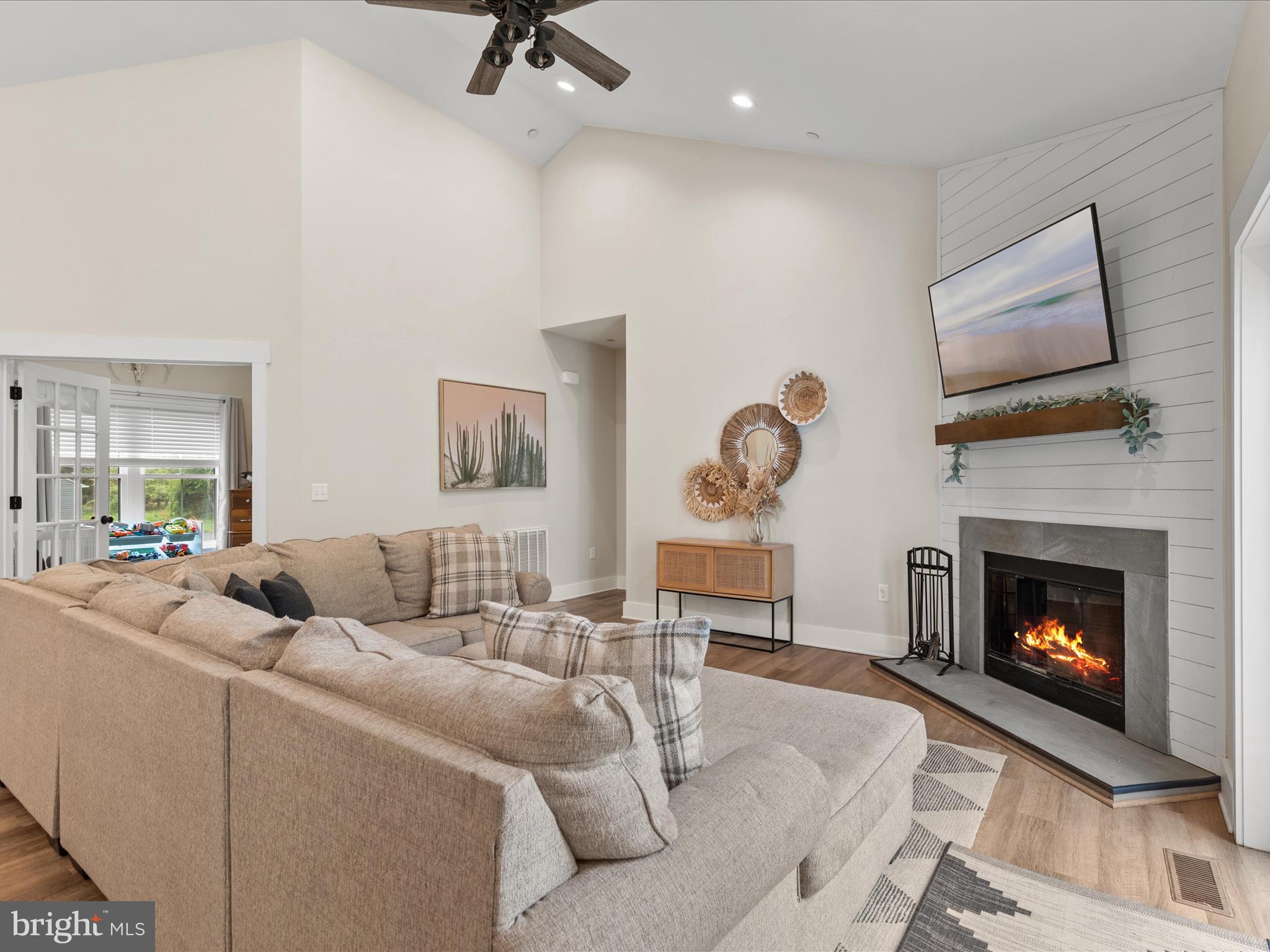 9741 Mason Road Berlin, MD 21811 - Photo 23 of 71 a living room with furniture and a fireplace