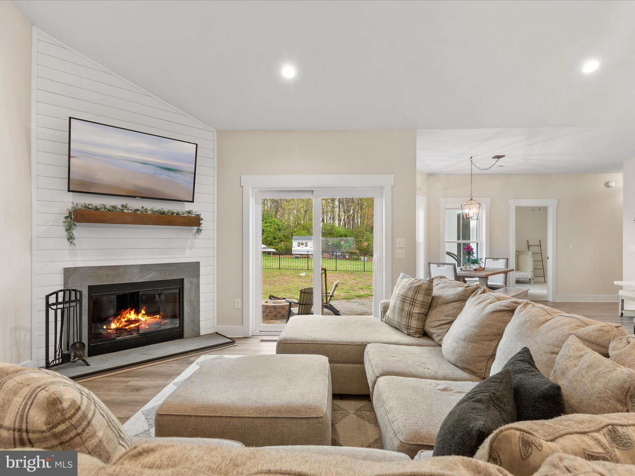 9741 Mason Road Berlin, MD 21811 - Photo 28 of 71 a living room with furniture window and a fireplace