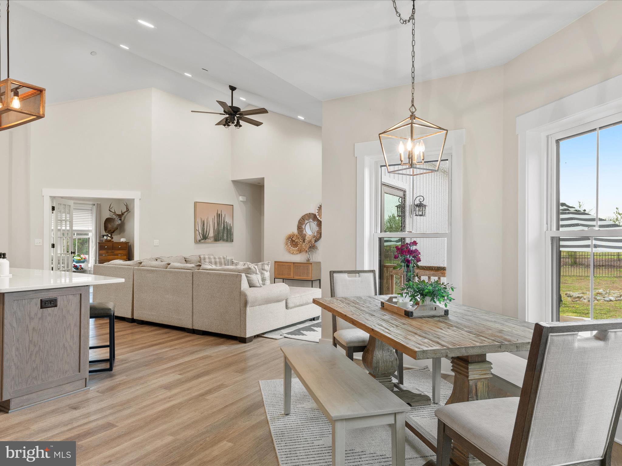 9741 Mason Road Berlin, MD 21811 - Photo 30 of 71 a living room with furniture a chandelier and a table