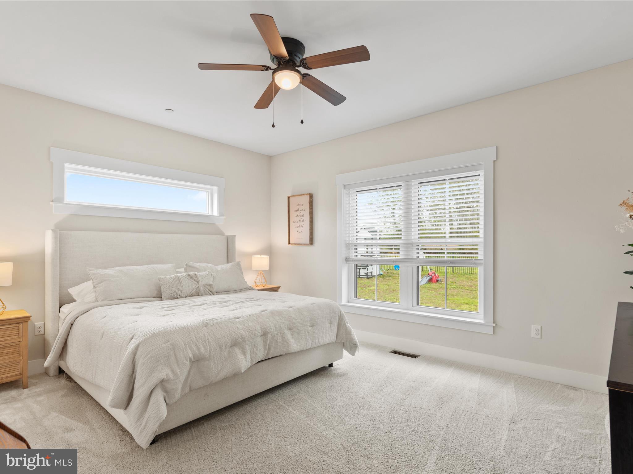 9741 Mason Road Berlin, MD 21811 - Photo 32 of 71 a bedroom with a bed and a window