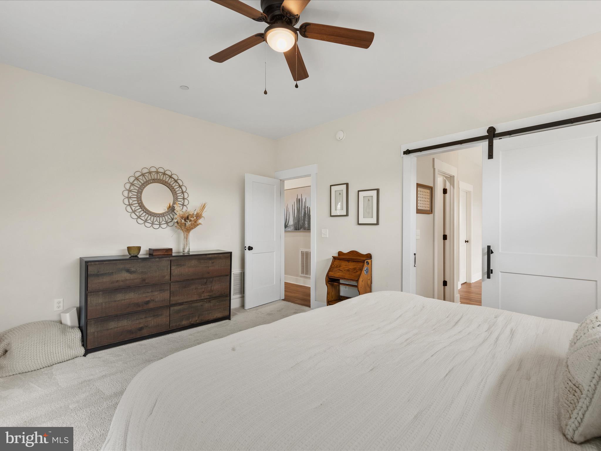 9741 Mason Road Berlin, MD 21811 - Photo 34 of 71 a bedroom with a bed and wooden floor