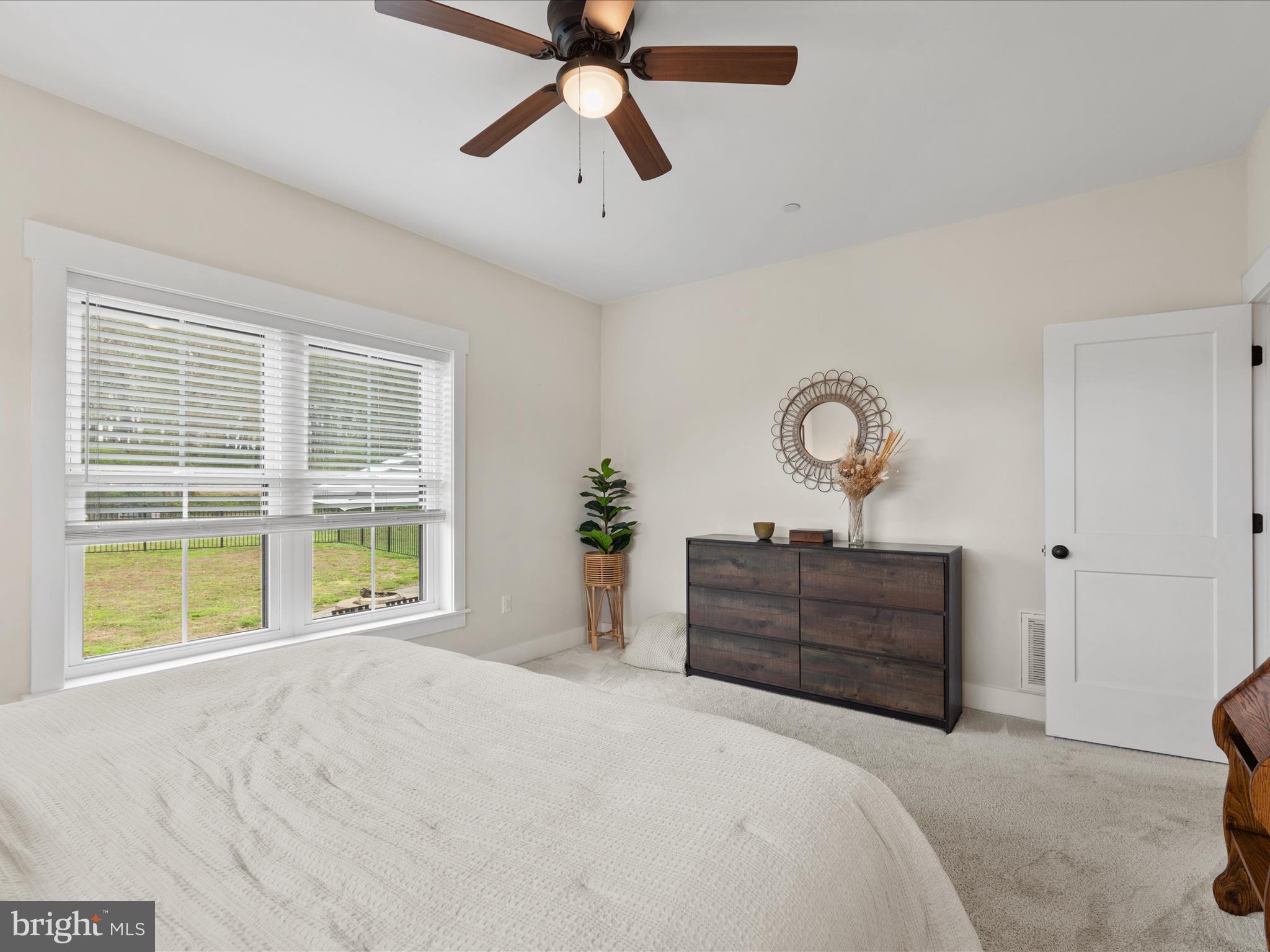 9741 Mason Road Berlin, MD 21811 - Photo 35 of 71 a bedroom with a bed and a large window
