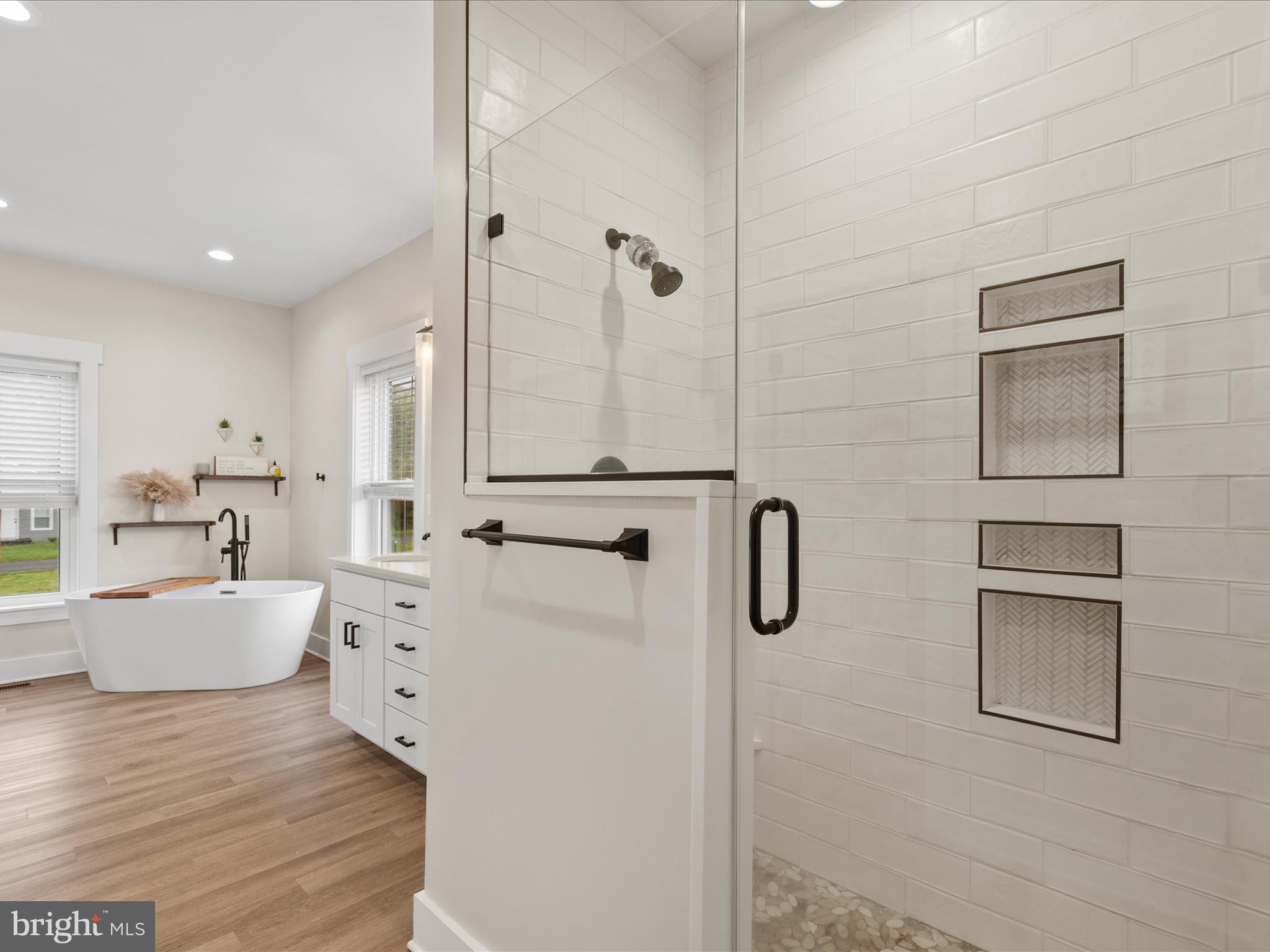 9741 Mason Road Berlin, MD 21811 - Photo 38 of 71 a large white kitchen with refrigerator stove and white cabinets