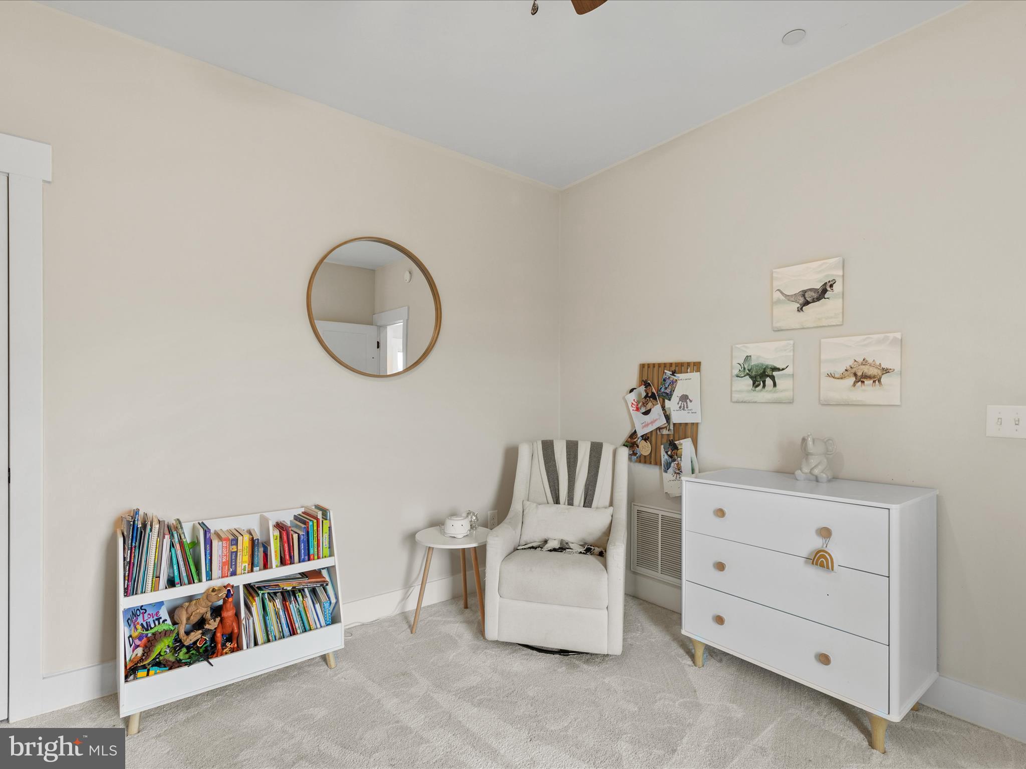 9741 Mason Road Berlin, MD 21811 - Photo 42 of 71 a room with a baby crib a dresser and a book shelf