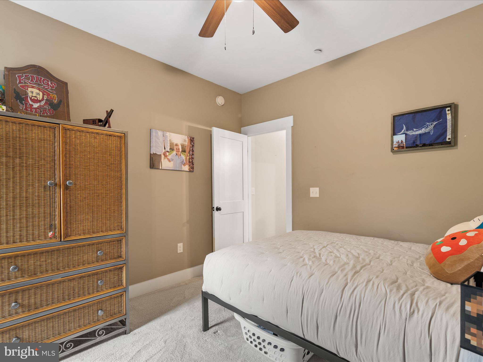 9741 Mason Road Berlin, MD 21811 - Photo 45 of 71 a bedroom with a bed and a cabinets