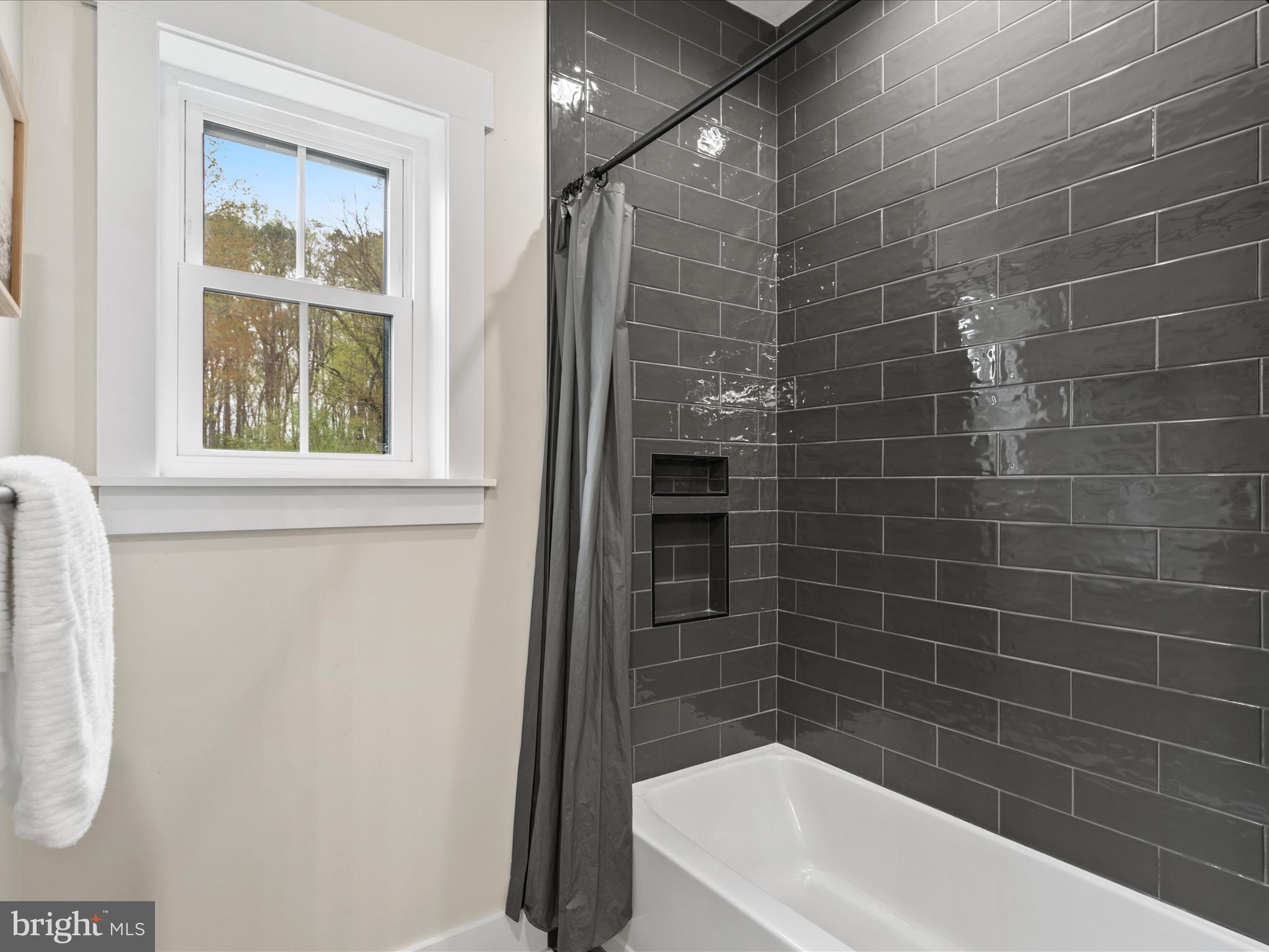 9741 Mason Road Berlin, MD 21811 - Photo 47 of 71 a bathroom with a bathtub and a shower