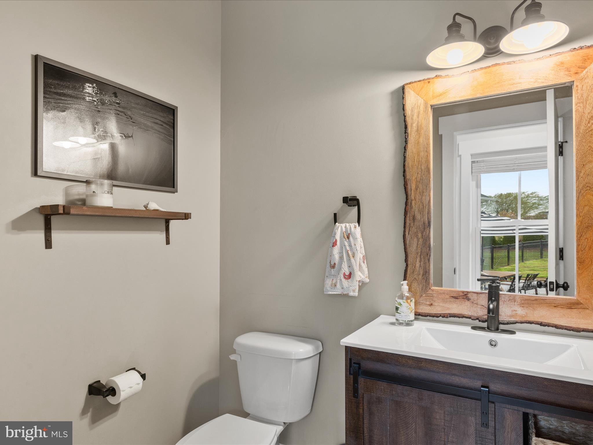 9741 Mason Road Berlin, MD 21811 - Photo 52 of 71 a bathroom with a toilet sink and mirror