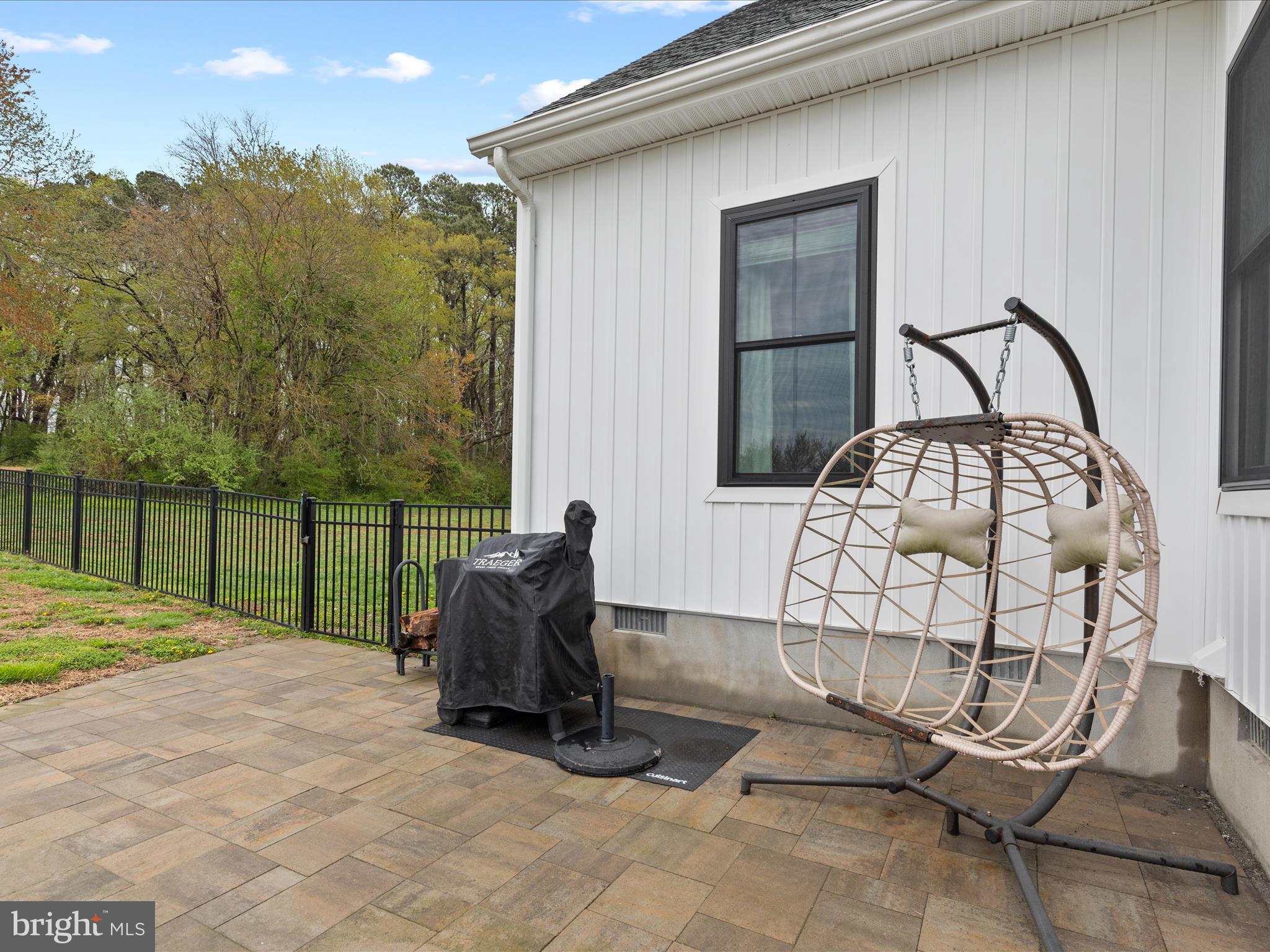 9741 Mason Road Berlin, MD 21811 - Photo 54 of 71 a view of a chair and table in the back yard of the house