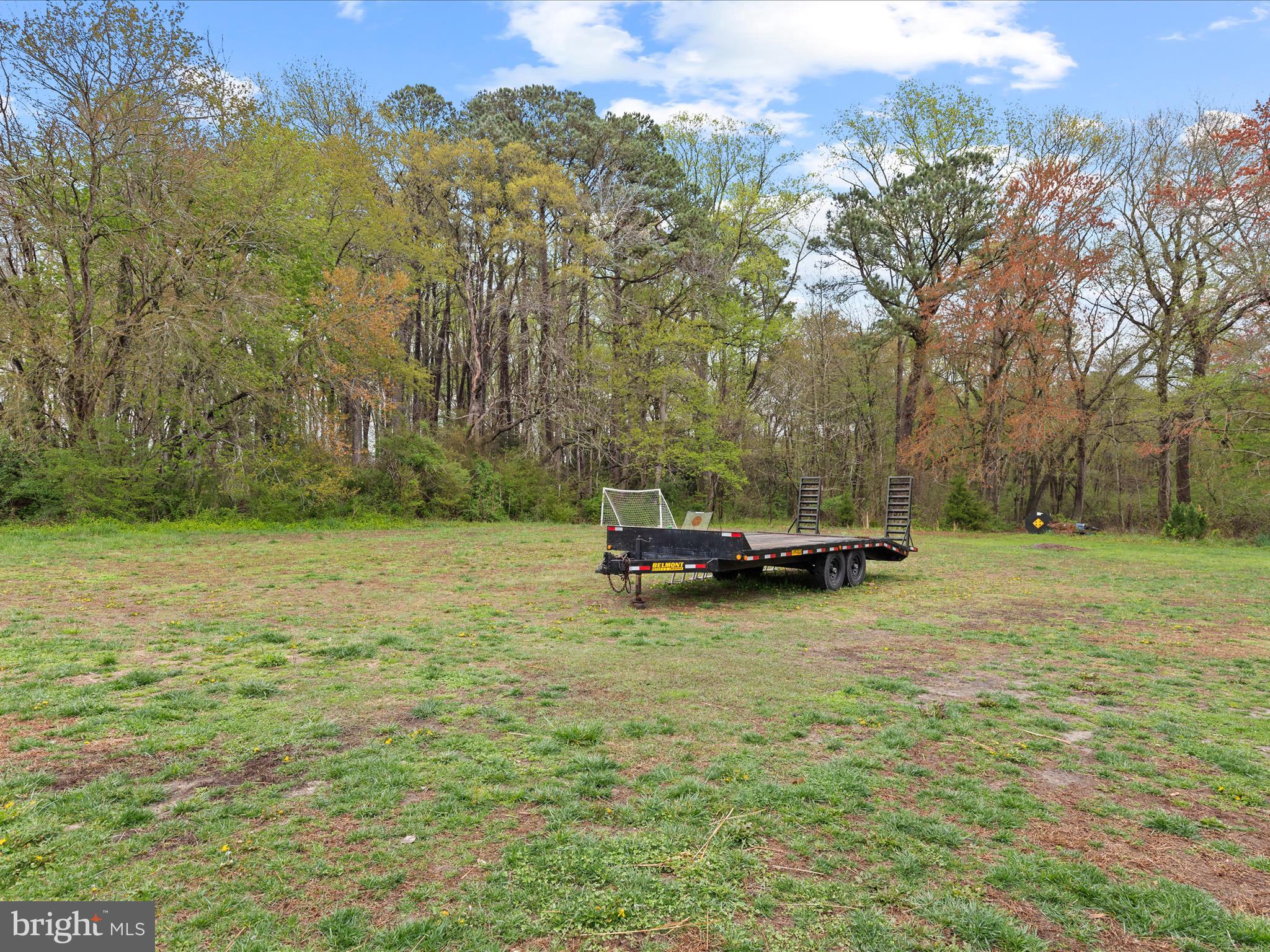 9741 Mason Road Berlin, MD 21811 - Photo 58 of 71 a view of a yard with a bench