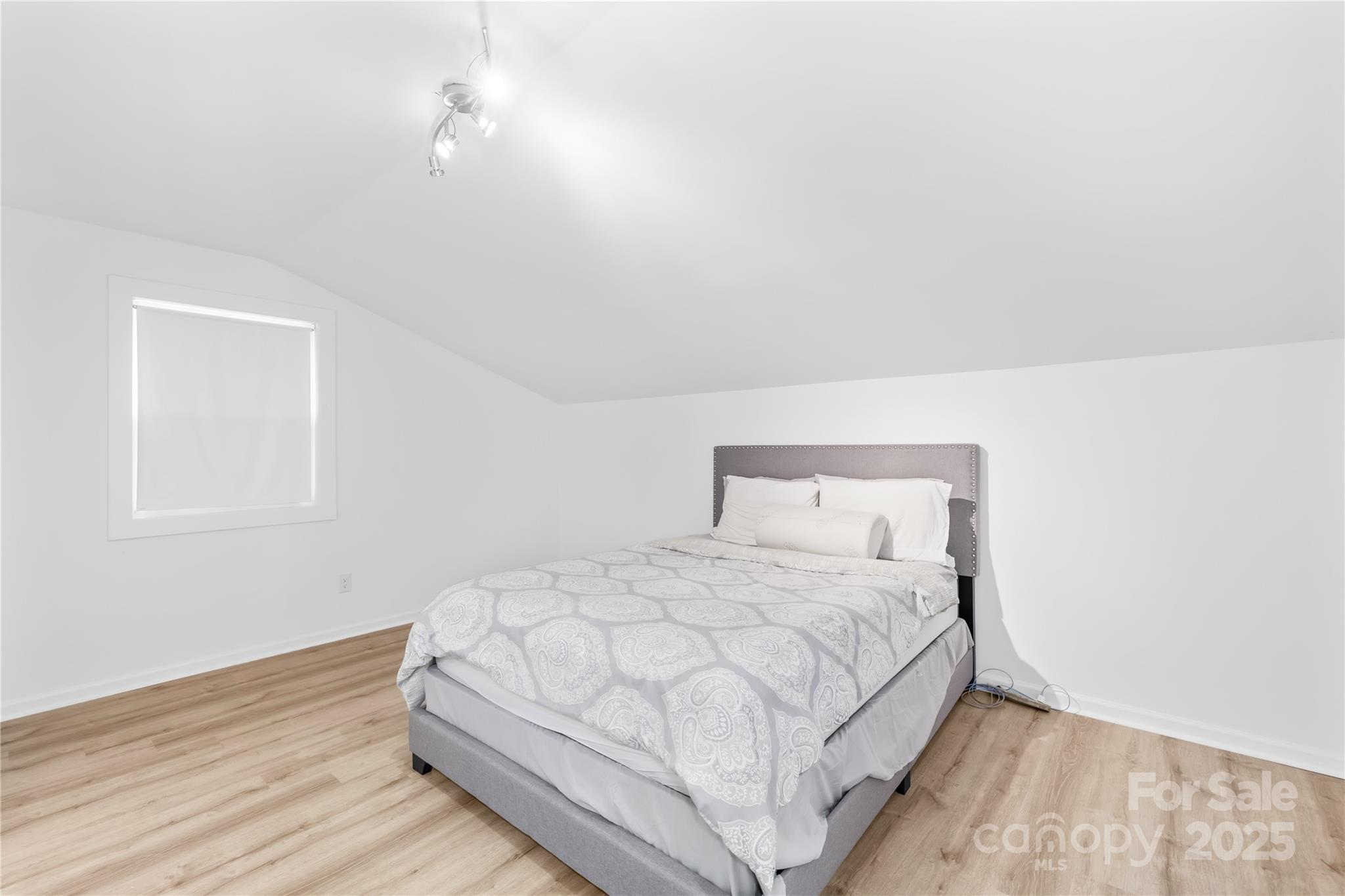 221 Reliance Road Kings Mountain, NC 28086 - Photo 20 of 26 a bedroom with a bed and a night stand