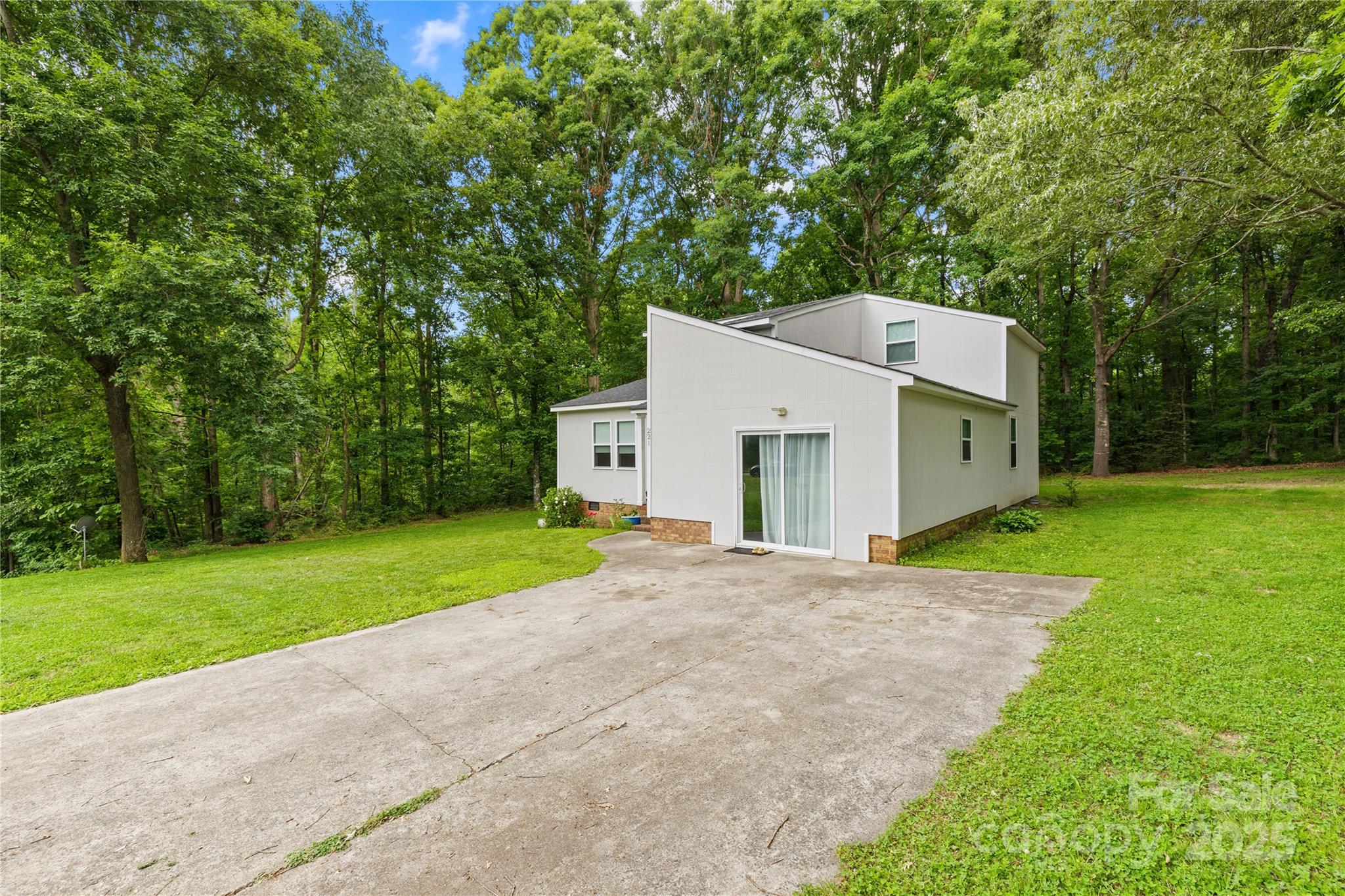 221 Reliance Road Kings Mountain, NC 28086 - Photo 2 of 26 a view of a house with a yard and a garage