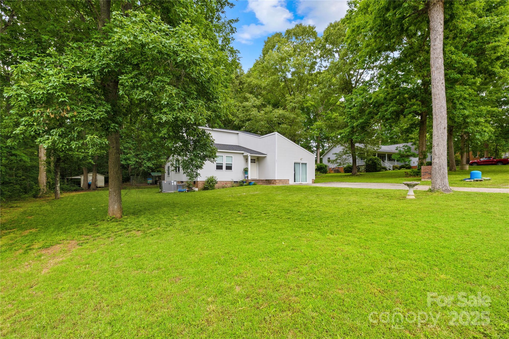 221 Reliance Road Kings Mountain, NC 28086 - Photo 3 of 26 a view of house with a big yard and large trees